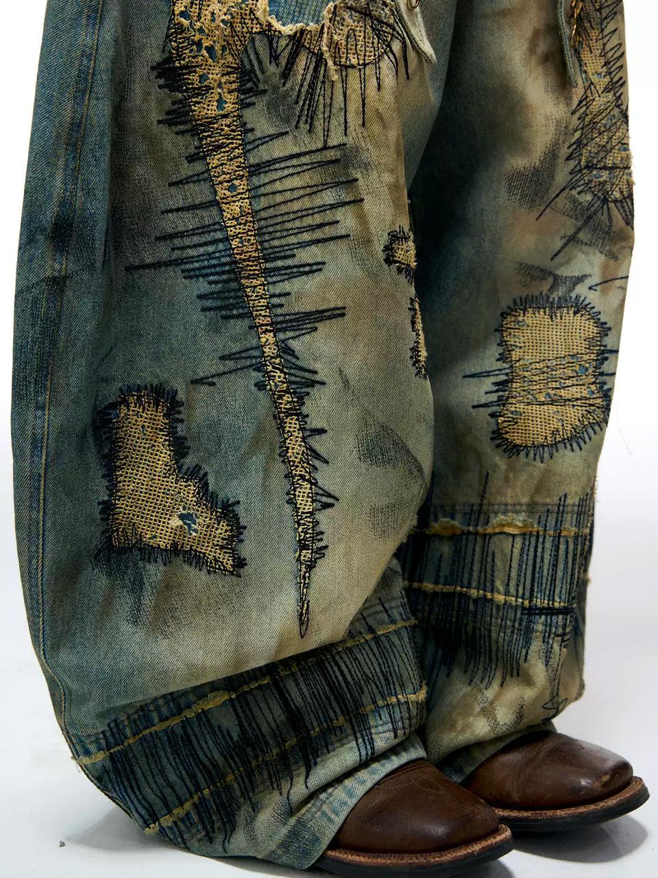 Stain Embroidery Scimitar Jeans
